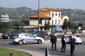 Police officers take position after an attack in a high school student in Grasse, southern France.