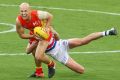 Gary Ablett is tackled by Liam Picken of the Bulldogs.