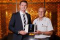 Charles Brownlow IV poses for a photo with the reigning Brownlow medallist Patrick Dangerfield 