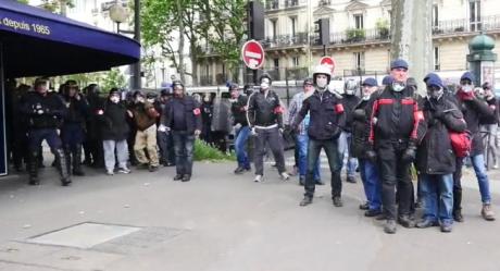 CGT stewards alongside French riot police.