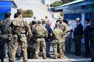 U.S. Secretary of State Rex Tillerson is briefed by U.S. soldiers in front of the Joint Security Area (JSA) of the Korean Demilitarized Zone (DMZ) in Panmunjon, South Korea, on March 17, 2017.