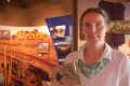 Melita Honey Farm's Fanny Beerepoot with the farm's book <i>Bees Around The World</i>.