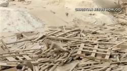 Watch woman escape raging mudslide in Peru