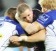 Wrapped up: Captain Ryan Hoffman is tackled at Forsyth Barr Stadium.