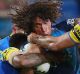 Hair-raising: The Eels defence grapples with Kevin Proctor.