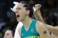 From left, Australia center Liz Cambage, guard Tessa Lavey (4), center Marianna Tolo (14) and guard Penny Taylor cheer ...