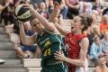 Ranger Natalie Novosel jumps into the defence of Toni Edmondson of Perth Lynx.