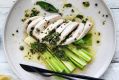 Champagne-poached chicken and leeks with summer herb butter.