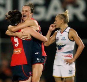 Melbourne players celebrating beating Adelaide. 