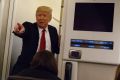 Obama did it: US President Donald Trump speaks to reporters aboard Air Force One before landing in Maryland last week.