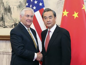 Wang Yi (R) shakes hands with U.S. Secretary of State Rex Tillerson at Diaoyutai State Guesthouse on March 18, 2017 in Beijing, China.