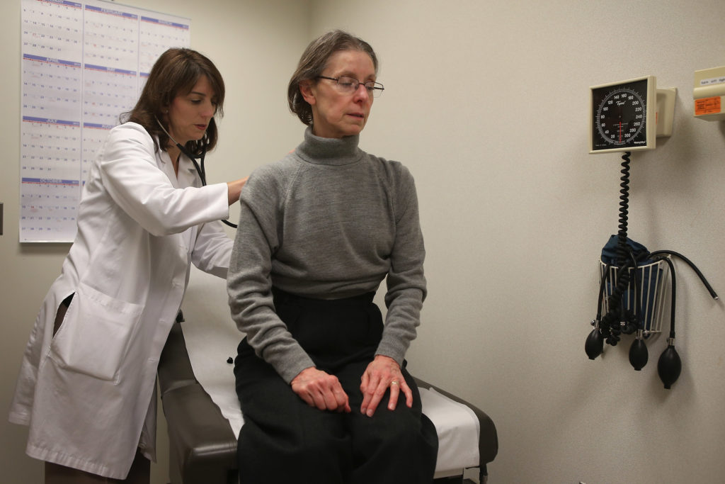 Dr. Anne Furey Schultz examines a patient complaining of flu-like symptoms at Northwestern Memorial Hospital in Chicago.