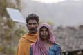 Jurdar Thingya and his wife Kompla Jurdar in front of a broken solar panel outside their home in the village of Bhamana, ...