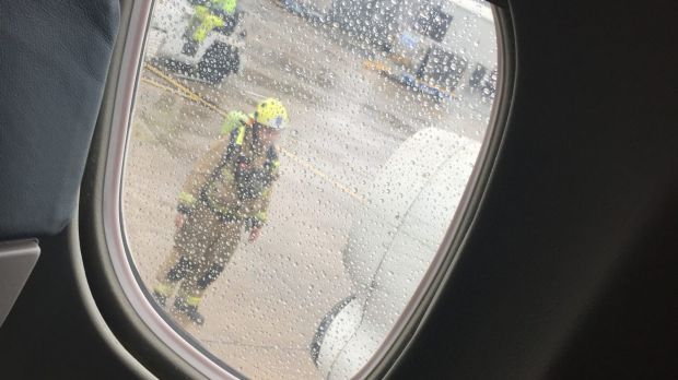 Passenger Alyce Fisher's photograph of emergency services outside the plane.