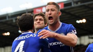 STOKE ON TRENT, ENGLAND - MARCH 18: Gary Cahill of Chelsea (R) celebrates scoring his sides second goal with Cesc ...