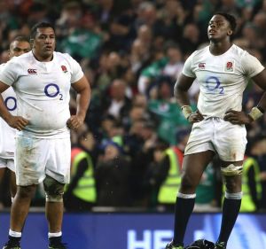 Shocked: England players come to terms with their loss against Ireland.