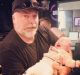 Kyle Sandilands with Michael and Kyly Clarke's baby, Kelsey Lee, last year.