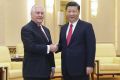 Chinese President Xi Jinping (right) shakes hands with US Secretary of State Rex Tillerson in the Great Hall of the ...