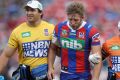 Brendan Elliot of the Knights leaves the ground after getting injured.