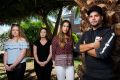 IGA supermarket workers Jimmy Siljanovski (R) with his colleagues (L-R) Tahlia Lemon, Lauren Morrison and Khadija Acone.