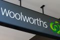 Signage for Woolworths Ltd. is displayed at one of the company's supermarkets in Sydney, Australia, on Tuesday, July 26, ...