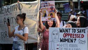 Joyful: Feminists, gender equity activists, and general supporters of women's rights rallied to mark International ...