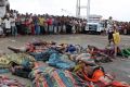 Bodies of Somalis killed in attack off the coast of Yemen lie on the ground at the Red Sea port of Hodeida, Yemen.