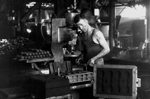 A worker at the one of the munitions factories in south-east Queensland circa 1942. Source: SLQ Image 99531