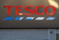 Tesco chairman John Allan said white men were an "endangered species" on corporate boards and had to "work twice as hard".