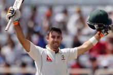 Glenn Maxwell, arms aloft, celebrates his ton