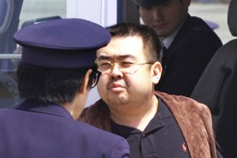 Kim Jong-nam escorted by officials