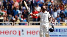 Cheteshwar Pujara looks to the skies after a century in Ranchi