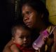 Seven-month pregnant Ruth-Jane Sombrio, widow of Rogie Sebastian, with their daughter Rogielyn (left) and son Rogie.