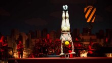 Mason West performs a risky handstand