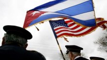 Cuban American vetrans hold Cuban and US flags