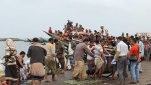 The body of a Somali refugee being carried to shore in Hodeidah, Yemen.