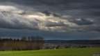 Dark clouds over country landscape