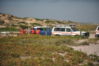 SES officials near cars during jury visit to Salt Creek.