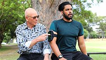 Dr Karl helps a passing jogger with podcasts.