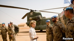 FILE - German Defense Minister Ursula von der Leyen speaks to German army Bundeswehr soldiers during a visit to Camp Castor in Gao, Mali, Dec. 19, 2016. 