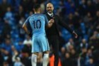 Pep Guardiola (R) shakes hands with Sergio Aguero after the draw with Liverpool.