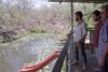 people in a demountable home with a pond and slide