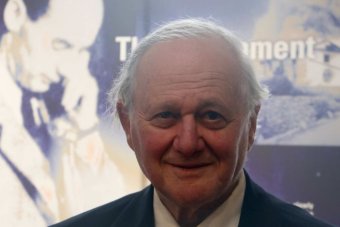 Frank Vajda in front of the memorial monument 