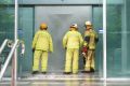 Firefighters respond to a fire alarm and building evacuation on Turbot Street, Brisbane.