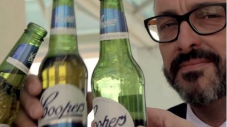 The video is laced with lingering shots of Coopers beers.