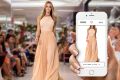 The face of Myer, Jennifer Hawkins, demonstrates the new Catwalk to Cart feature that will debut at the store's ...