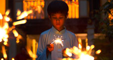 Ramadan. Little boy with sparklers. During the holy month of Ramadan Muslims break their fast each evening with prayer followed by festive nighttime meals called iftars. Islam