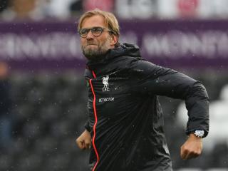 Liverpool's German manager Jurgen Klopp celebrates victory at the end of the English Premier League football match between Swansea City and Liverpool at The Liberty Stadium in Swansea, south Wales on October 1, 2016. / AFP PHOTO / GEOFF CADDICK / RESTRICTED TO EDITORIAL USE. No use with unauthorized audio, video, data, fixture lists, club/league logos or 'live' services. Online in-match use limited to 75 images, no video emulation. No use in betting, games or single club/league/player publications. /