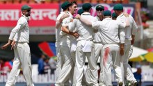 Pat Cummins and Australia celebrate the wicket of Virat Kohli