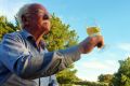 Ken Helm gives cheers to the arrival of the Batemans Breath at his Murrumbateman Vineyard.